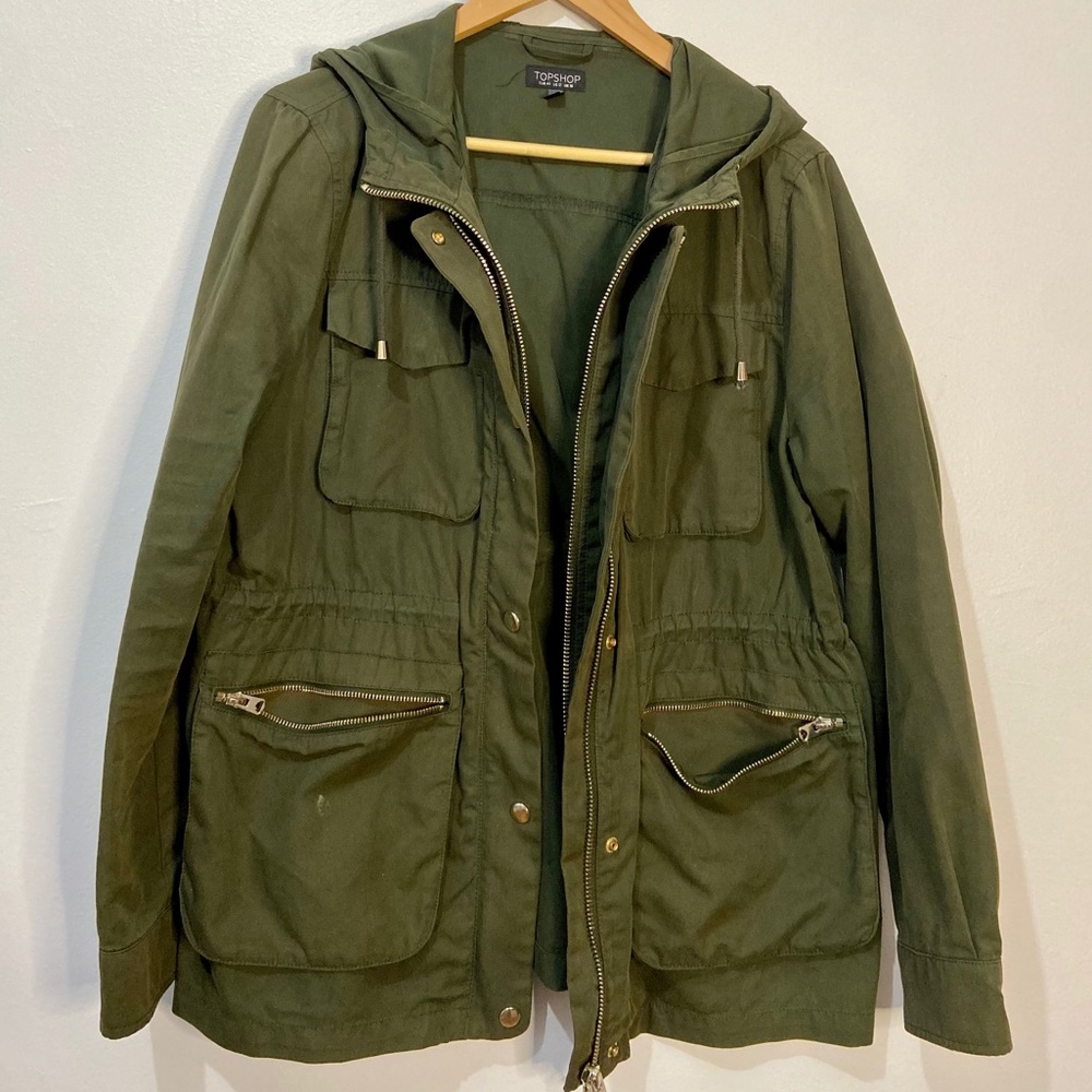 Olive green utility jacket with many pockets